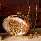Noor Golden Brass Mother of Pearl Clutch by The Tan Clan, showcasing a luxurious gold brass exterior with mother of pearl detailing.