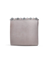 Nysa beige mini bag by The Tan Clan featuring an embroidered handle and compact design for stylish carrying.