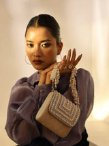 Nysa beige mini bag by The Tan Clan with an embroidered handle and compact design, perfect for stylish everyday use.