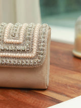 Nysa beige mini bag with embroidered handle from The Tan Clan, featuring a compact design and stylish embroidered strap.