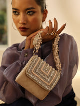 Nysa beige mini bag with embroidered handle by The Tan Clan, featuring a compact design and decorative handle detail.