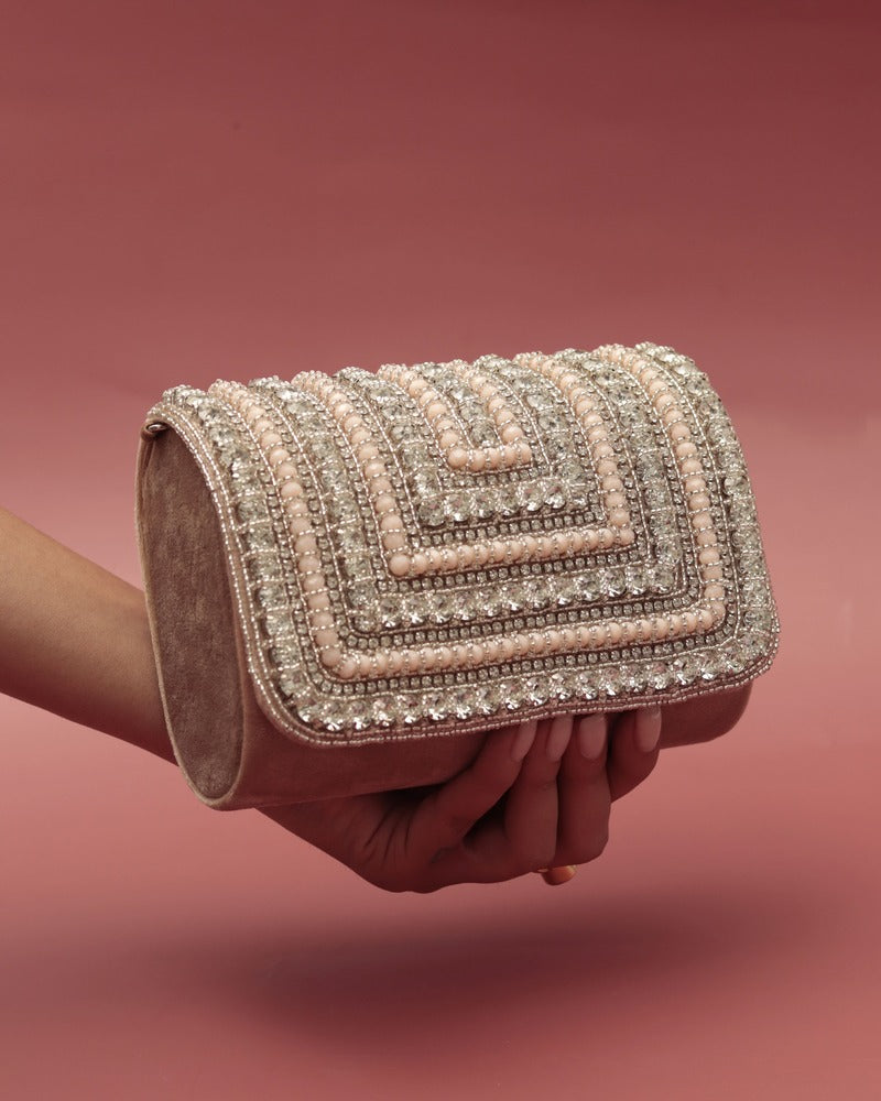 Nysa embellished flap-over clutch bag by The Tan Clan with decorative accents and sleek design, perfect for evening occasions.