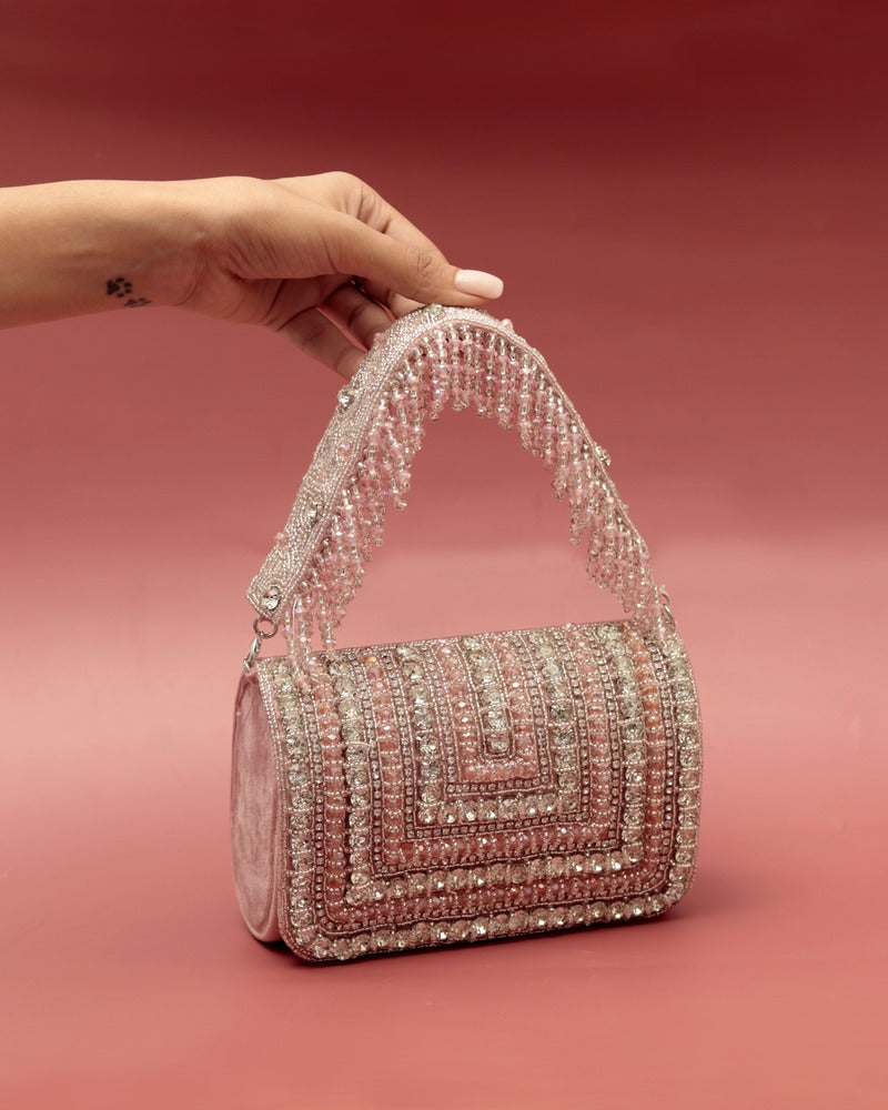 Nysa embellished flap-over clutch bag by The Tan Clan with decorative details and a sleek design for elegant occasions.