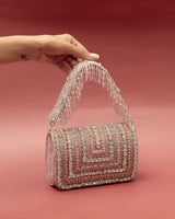 Nysa embellished flap-over clutch bag by The Tan Clan with decorative details and a sleek design for elegant occasions.