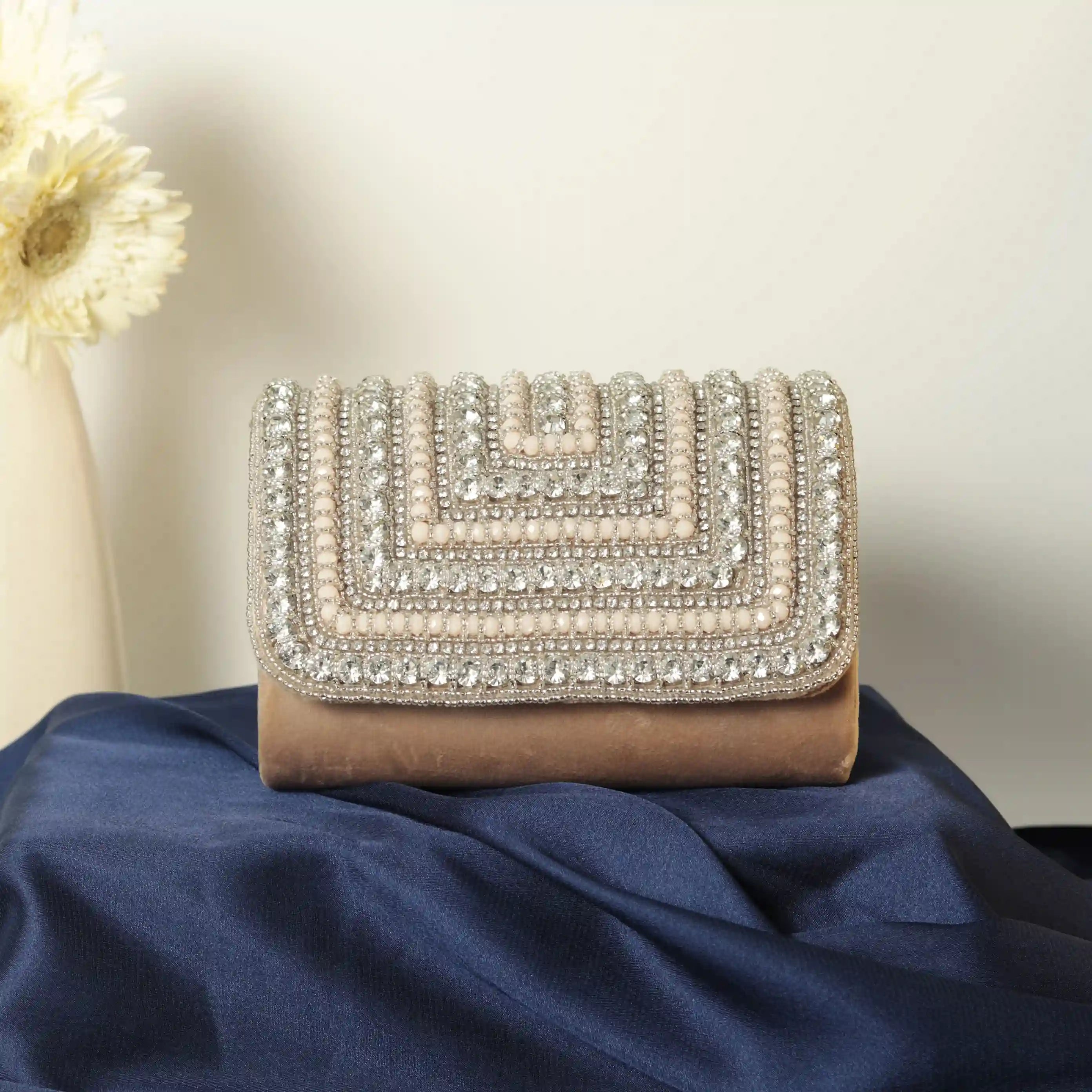 Nysa embellished flap-over clutch bag by The Tan Clan with intricate beadwork and a sleek design for elegant occasions.