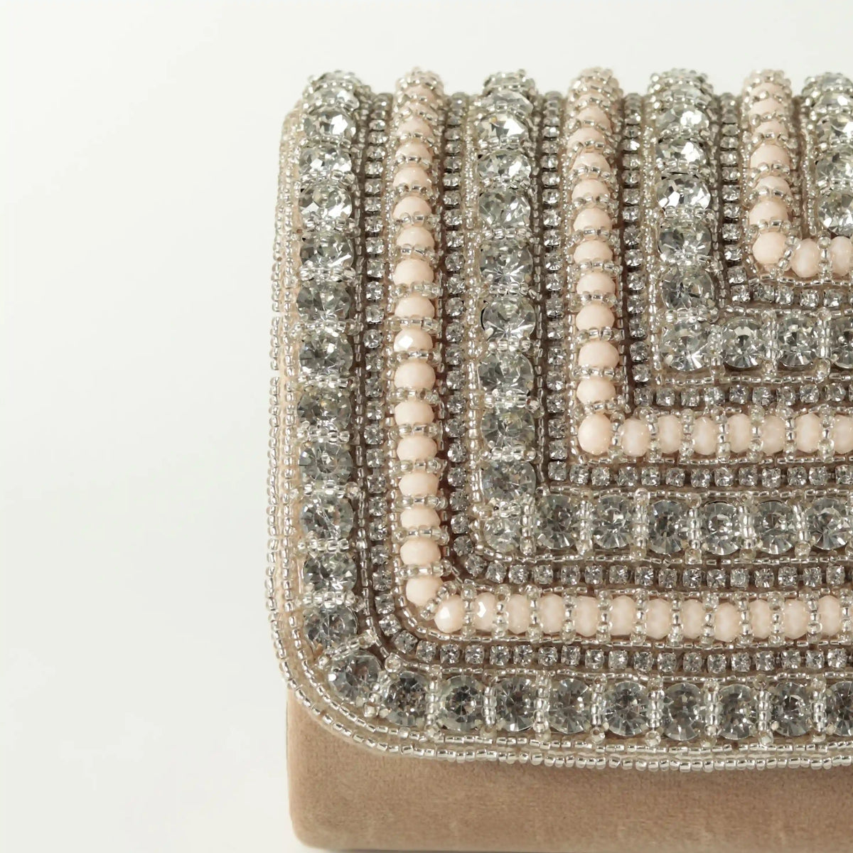 Nysa embellished flap-over clutch bag by The Tan Clan featuring decorative embellishments and a stylish design.