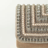 Nysa embellished flap-over clutch bag by The Tan Clan featuring decorative embellishments and a stylish design.
