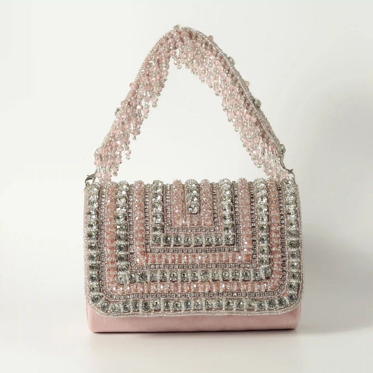 Nysa embellished flap-over clutch bag by The Tan Clan with decorative details and sleek design, suitable for evening or formal occasions.