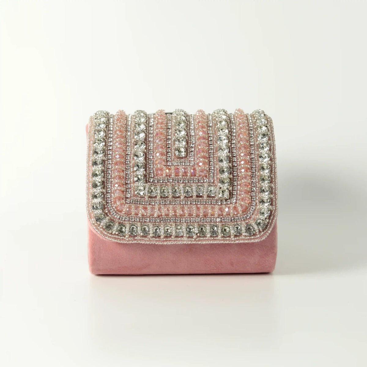 Pink Nysa Mini Bag with embroidered handle by The Tan Clan, showcasing a compact design and detailed handle embroidery.