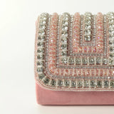 Pink Nysa mini bag by The Tan Clan with embroidered handle, featuring a compact design and stylish craftsmanship.