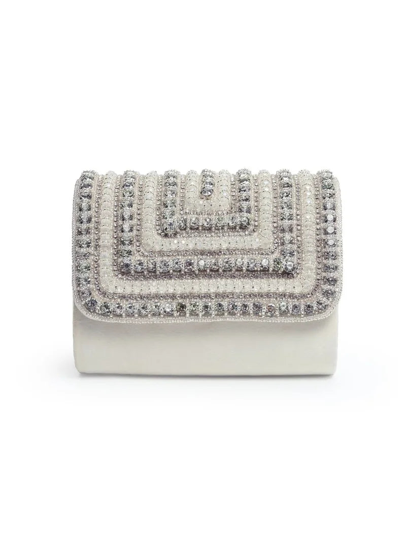 White Nysa clutch bag by The Tan Clan with embellished flap and sleek design, perfect for elegant evening events.