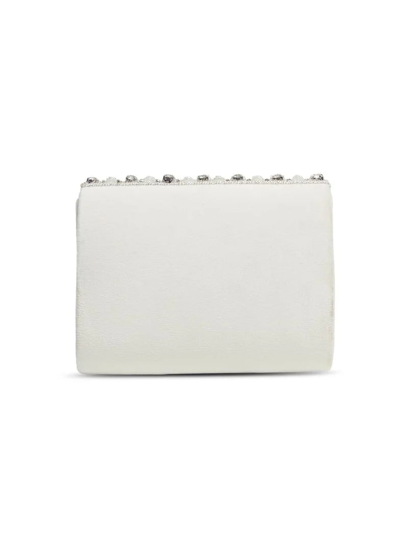 Nysa white embellished flap-over clutch bag by The Tan Clan with decorative details and a sleek, elegant design.