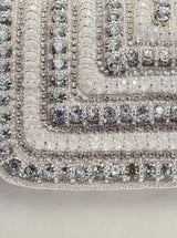 White Nysa clutch bag with embellished flap from The Tan Clan, featuring a stylish and elegant design perfect for evening accessories.