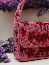 Tan Clan Orchid Baguette Bag with handle, showcasing its elegant design and structured silhouette.