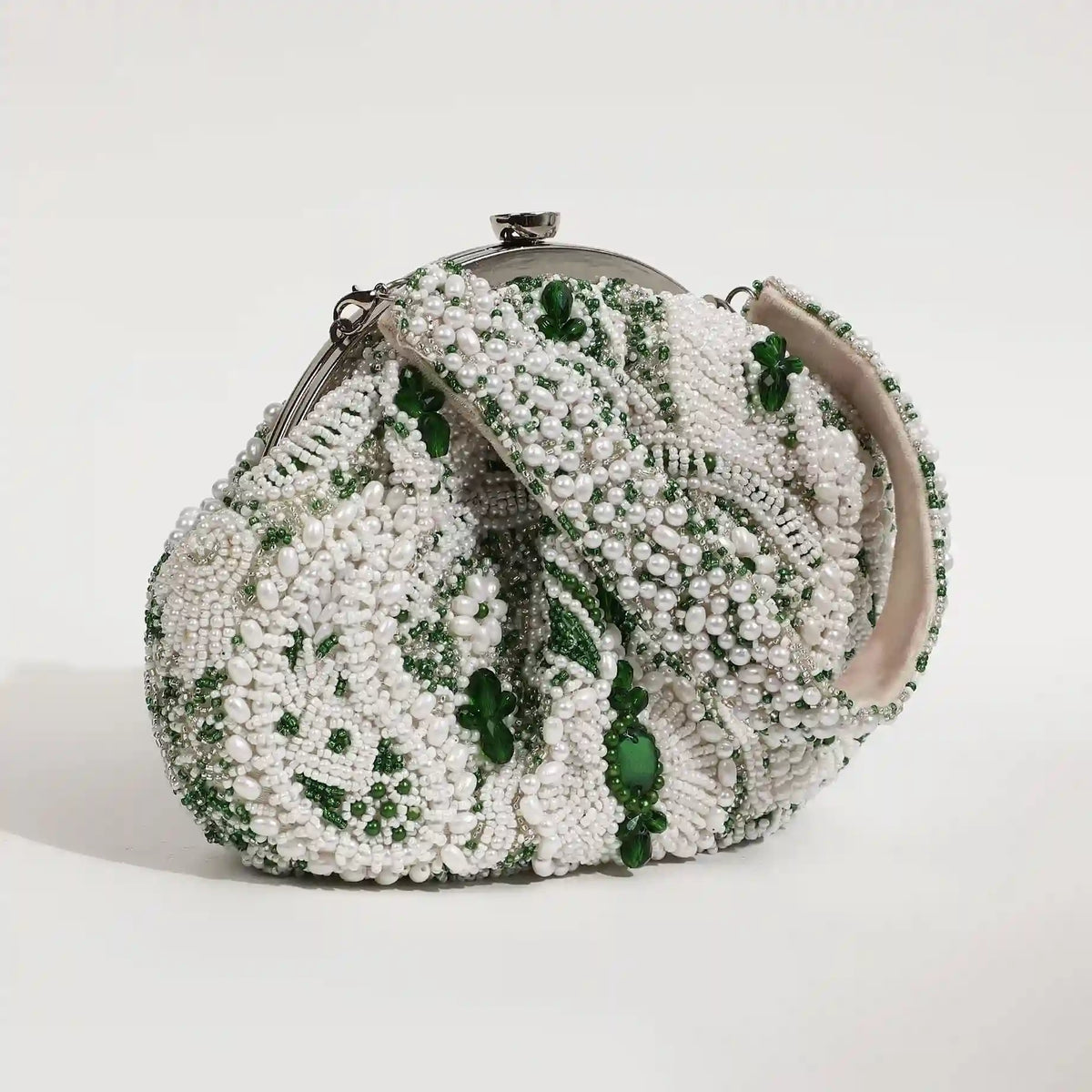 Tan Clan Paak Batua bag with detachable strap, showcasing its compact design and stylish look in natural leather.