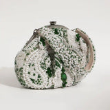 Tan Clan Paak Batua bag with detachable strap, showcasing its compact design and stylish look in natural leather.