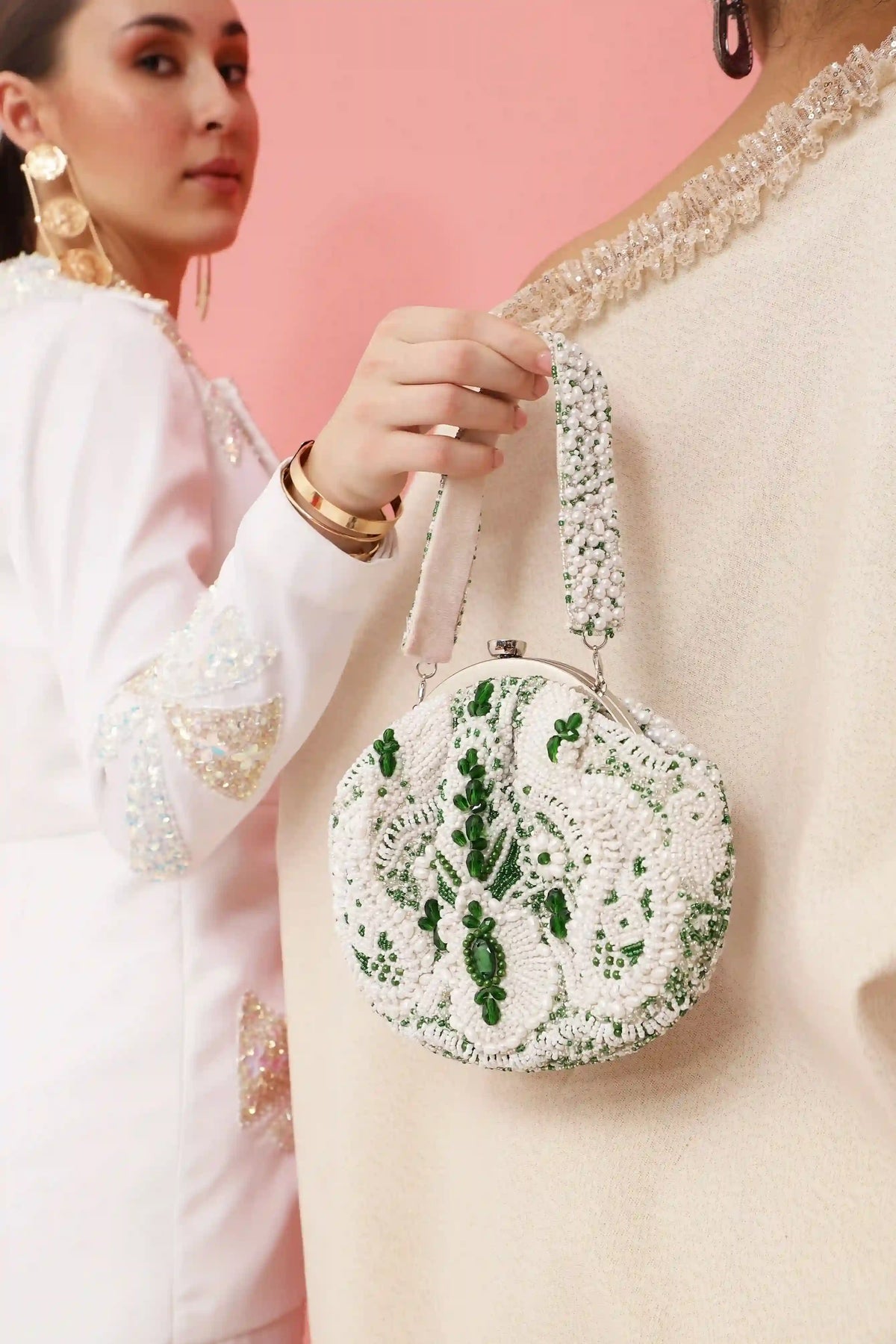 Tan Clan Paak Batua bag with detachable strap, showcasing traditional design and versatile carry options.