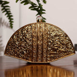 Golden brass Pankh Mother of Pearl clutch bag by The Tan Clan with intricate detailing and elegant design.