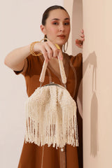 Pearl Batua bag with tassels from The Tan Clan, featuring a traditional design with pearl accents and decorative tassels.