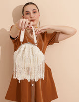 Pearl Batua bag with tassels from The Tan Clan, featuring a round shape, pearl accents, and decorative tassel details.