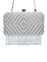 Pearly silver hand-embroidered clutch bag with intricate designs, featuring a sleek rectangular shape and elegant craftsmanship.