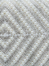 Pearly silver hand-embroidered clutch bag with intricate embroidery and elegant design from The Tan Clan.