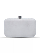 Pearly white hand-embroidered clutch bag by The Tan Clan with intricate floral embroidery and a sleek, elegant design.