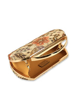 Petal beige capsule clutch by The Tan Clan featuring a sleek, compact design with a textured exterior and minimalist style.