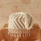 Petite embroidered mini potli bag with glass bead hangings by The Tan Clan, showcasing intricate embroidery and decorative beads.