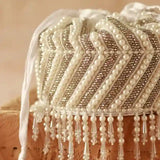 Petite embroidered mini potli bag by The Tan Clan with glass bead hangings and intricate embroidery, perfect for traditional occasions.
