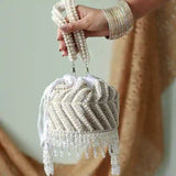 Petite embroidered mini potli bag with glass bead hangings by The Tan Clan, showcasing intricate embroidery and decorative beads.