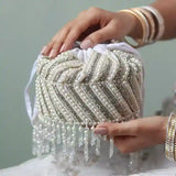 Petite embroidered mini potli bag by The Tan Clan with glass bead hangings and intricate embroidery for traditional occasions.