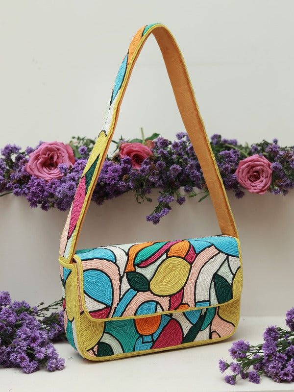 Poppy multicolor baguette bag with a handle from The Tan Clan, featuring vibrant woven design and compact, rectangular shape.