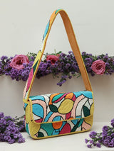 Poppy multicolor baguette bag with a handle from The Tan Clan, featuring vibrant woven design and compact, rectangular shape.