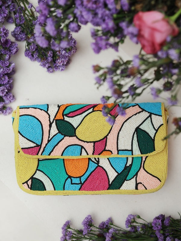 Multicolor Poppy Baguette Bag with handle by The Tan Clan, featuring vibrant woven design and compact, stylish shape.