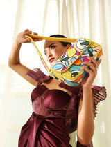 Multicolor Poppy Baguette Bag with Handle by The Tan Clan, featuring vibrant woven design and comfortable shoulder strap.