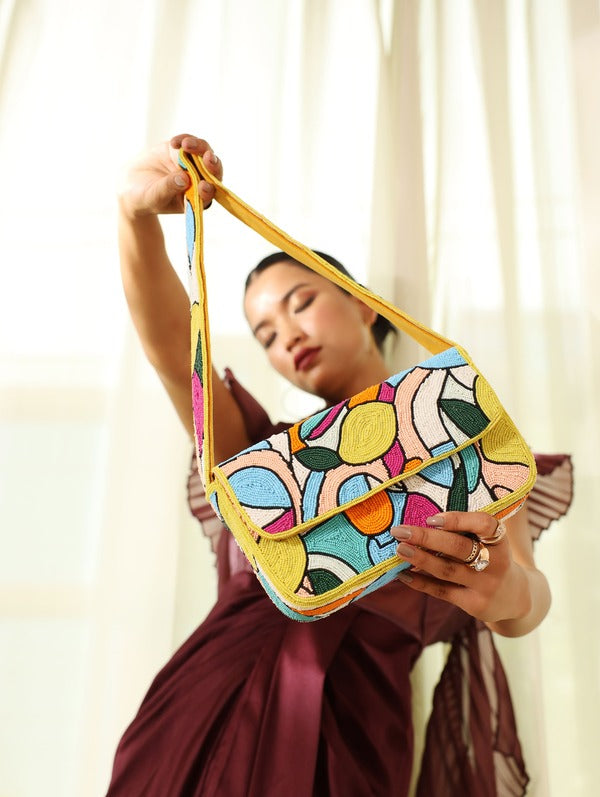 Multicolor Poppy Baguette Bag with Handle by The Tan Clan, featuring vibrant woven design and sleek shoulder strap.