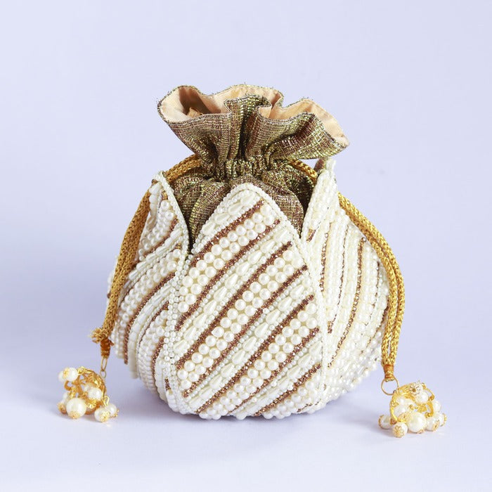 Hand-embroidered mini lotus potli bag by The Tan Clan with intricate detailing and traditional design, perfect for special occasions.