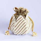 Hand-embroidered mini lotus potli bag by The Tan Clan with intricate detailing and traditional design, perfect for special occasions.