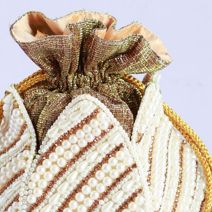 Hand-embroidered Purva mini lotus potli purse with intricate floral detailing, crafted by The Tan Clan.