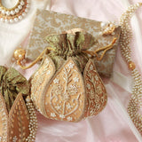 Pushp Zardozi embroidered mini lotus potli bag by The Tan Clan featuring intricate gold embroidery and traditional design.