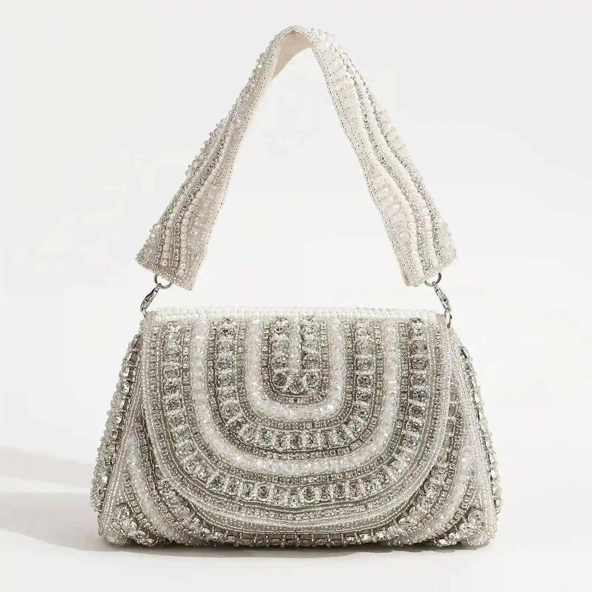 Chloe Flap Over Bag with Handle by The Tan Clan, featuring a sleek design and gold-tone hardware on a stylish handbag.