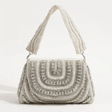 Chloe Flap Over Bag with Handle by The Tan Clan, featuring a sleek design and gold-tone hardware on a stylish handbag.