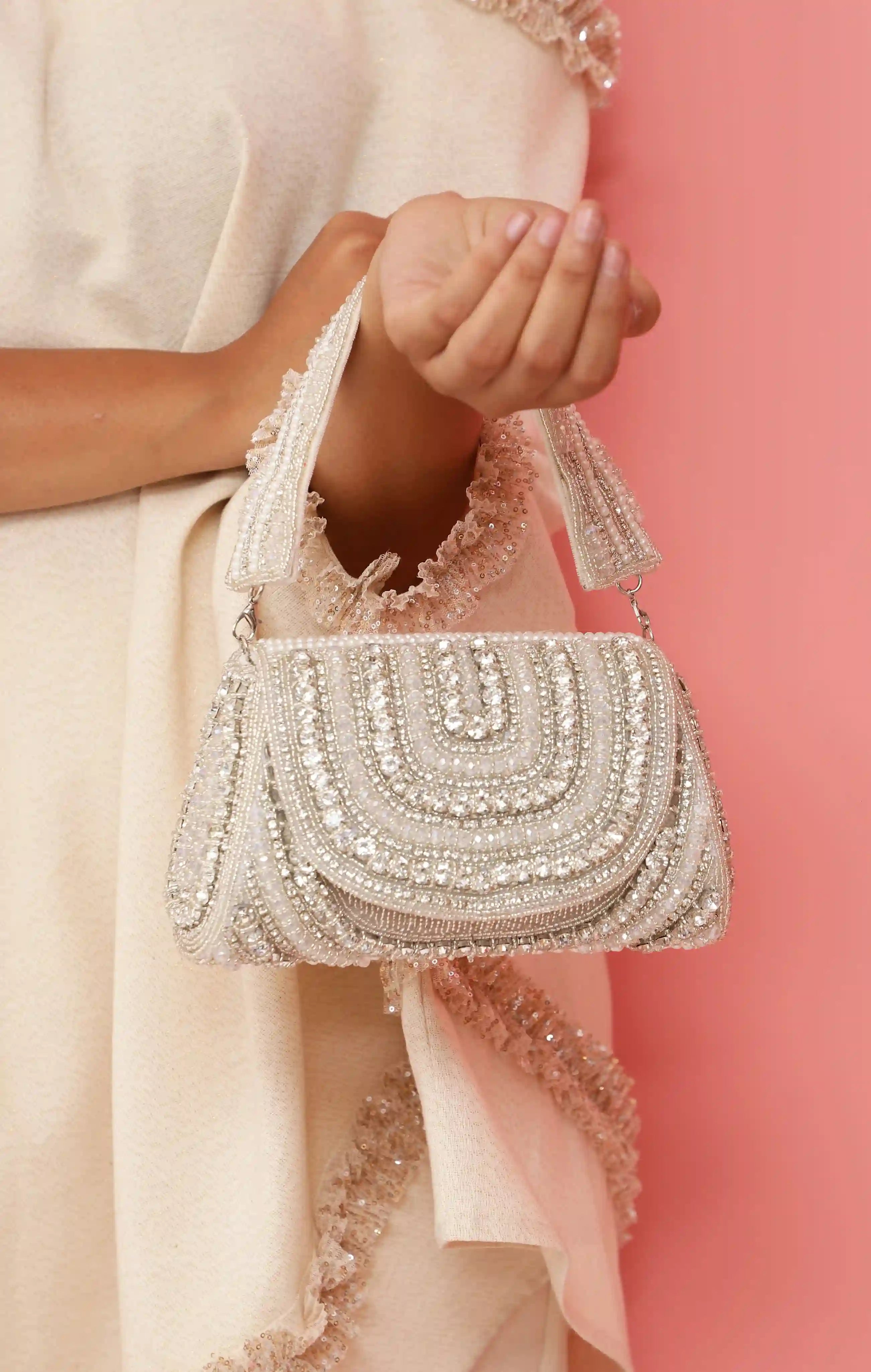 Chloe Flap Over Bag with Handle by The Tan Clan, featuring a sleek design and structured shape in a neutral tone.