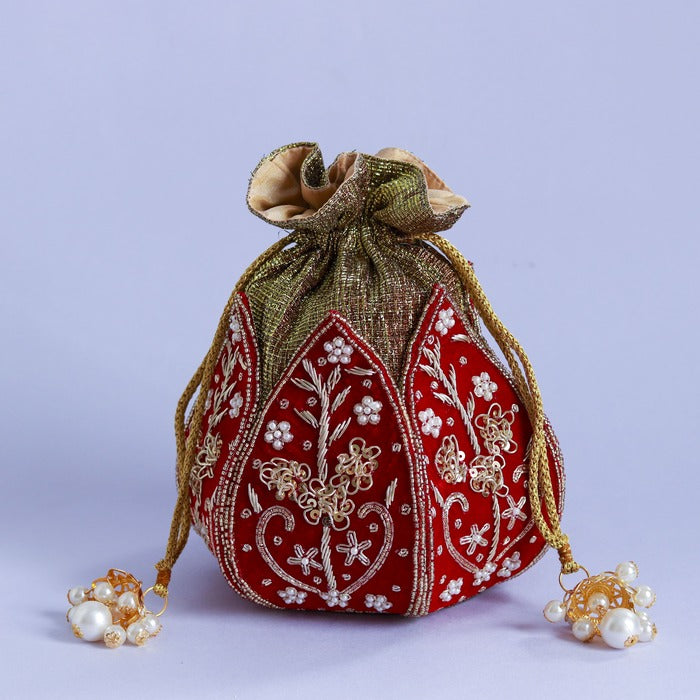 Mini lotus potli bag with Pushp Zardozi embroidery by The Tan Clan, featuring intricate floral designs and traditional craftsmanship.