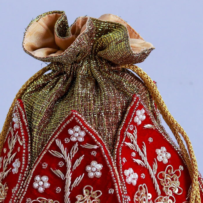 Zardozi embroidered mini lotus potli bag with intricate detailing, crafted by The Tan Clan.