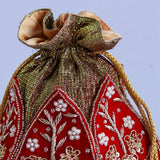 Zardozi embroidered mini lotus potli bag with intricate detailing, crafted by The Tan Clan.
