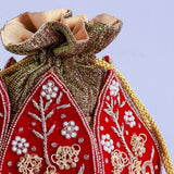 Pushp Zardozi embroidered mini lotus potli bag by The Tan Clan with intricate gold thread embroidery and decorative tassels.
