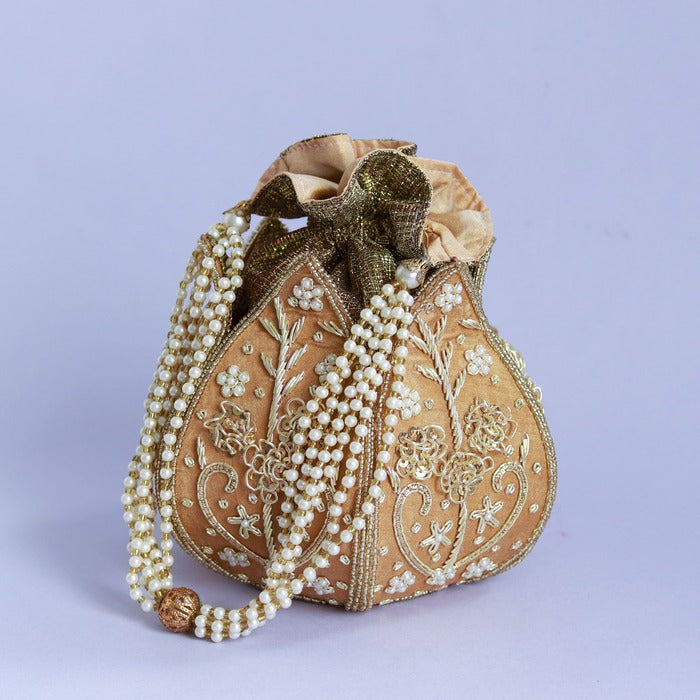 Pushp Zardozi embroidered mini lotus potli bag by The Tan Clan with intricate gold and colorful thread embroidery.