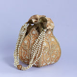 Pushp Zardozi embroidered mini lotus potli bag by The Tan Clan with intricate gold and colorful thread embroidery.